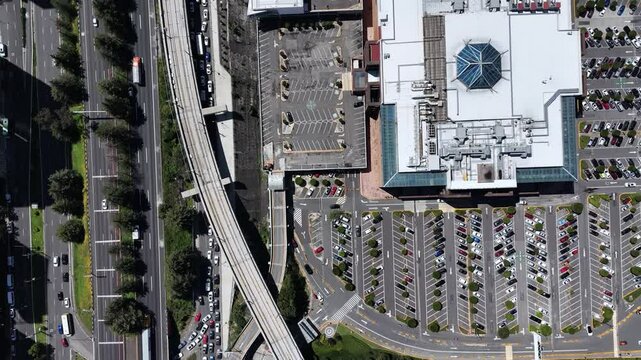 Overhead shot of Santa Fe mall parking and the intercity train in CDMX