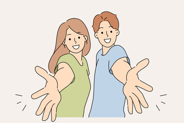 Welcoming gesture made by man and woman inviting you to visit or wanting to hug friends