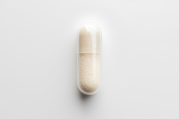 A single transparent capsule filled with white powder, representing a medication or supplement.