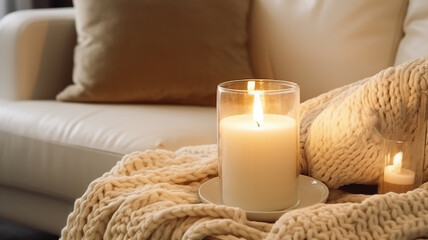 Burning candles in a cozy room interior in light beige colors in daylight