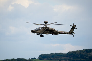 close-up side view of a British army Boeing Apache Attack helicopter gunship AH64E AH-64E...