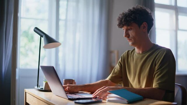 Online student open laptop lid at apartment workplace closeup. Man remote work