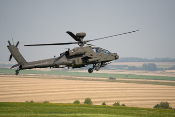 close-up side profile of a British army Boeing Apache Attack helicopter gunship AH64E AH-64E...