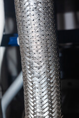 High pressure hose with metal braiding.