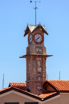 Clock tower in Lavrio port , Greece.. Sunny day with blue sky. It was built around 1870 -1880