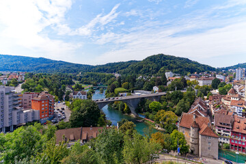 Obraz premium Aerial view of Swiss City of Baden with Limmat River and bridge on a sunny summer noon. Photo taken August 19th, 2023, Baden, Canton Aargau, Switzerland.