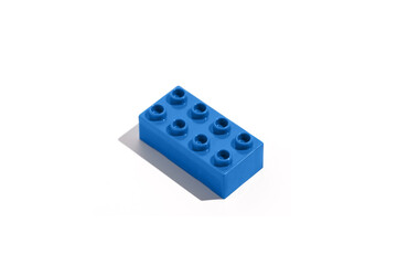Top view blue rectangular plastic block brick toy for construction on white isolated background....