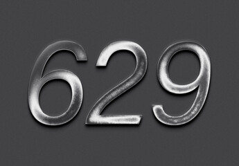 Chrome metal 3D number design of 629 on grey background.