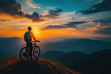 Fototapeta premium A cyclist pauses on a mountaintop. Perfect for articles on adventure, travel, or fitness.