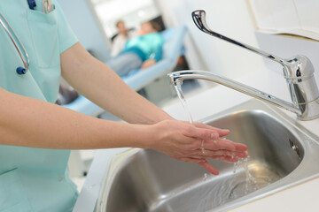 doctor washes hands before medical work