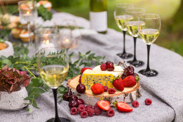 wine and cheese board at outdoor receprion or fancy brunch