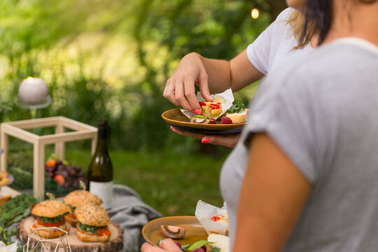 Friends enjoying brunch outside in a garden