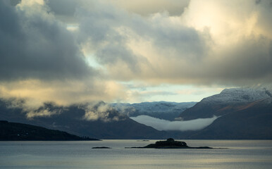 Dramatic landscape of autumn mountains over the northern fjords in Norway. Seasonal scenery of Scandinavia.
