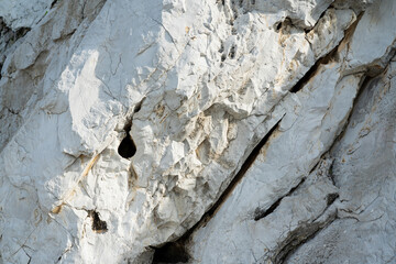Black white rock texture. Rough mountain surface. Stones texture and background. Surface of the...