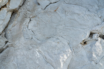 Fototapeta premium Black white rock texture. Rough mountain surface. Stones texture and background. Surface of the cave rock wall. Rock texture