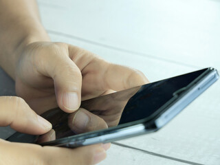 Hand using mobile phone, insurance or financial business concept.