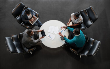 Diverse African Business Team Collaborating Around Modern Meeting Table