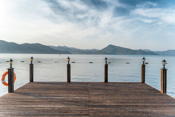 Wooden pier with sea and mountain views