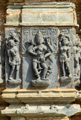 Carving of Jain goddess with maids at the Jain Temple, Arthuna Group of Temples, Banswara,...