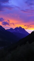 Majestic Mountain Silhouette at Sunset with Dramatic Purple Sky