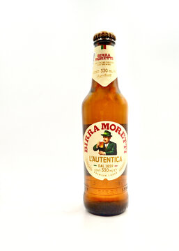 A bottle of Birra Moretti Premium lager isolated against a white background.