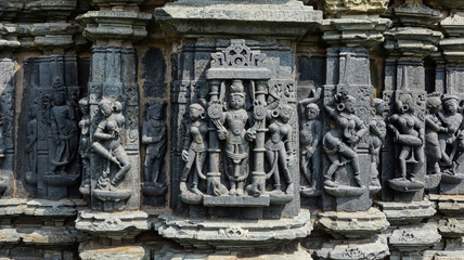 Carving of Lord Vishnu with musicians on Someshwara Mahadev Temple, Arthuna Group of Temples, Banswara, Rajasthan, India.