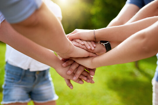 Hand stack, family and parents with kids outdoor for team building, support and vacation celebration. People, palm and circle with game agreement, partnership and summer community for nature bonding