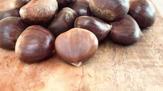 Chestnuts on the table freshly harvested from the forest.
