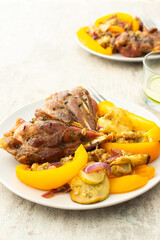 Enjoy a hearty breakfast or lunch with baked turkey served alongside roasted zucchini, sweet peppers, and onions