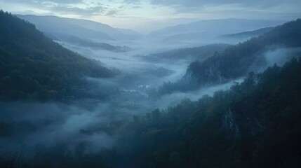 Serene fog rolling over a mountain valley at first light, creating an ethereal and dreamlike landscape of misty beauty