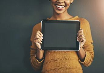 Woman holding digital tablet with a blank screen, copy space or chromakey for online advertising. Creative female with plain touch screen, branding for business logo or news and marketing.
