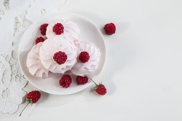 Marshmallow cookies with fresh raspberries for tea, selective focus