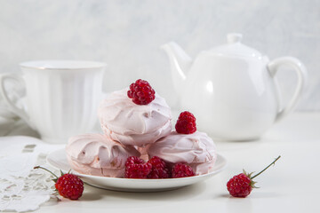 Marshmallow cookies with fresh raspberries for tea, selective focus