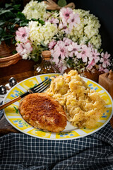 Minced meat cutlet with boiled sauerkraut.