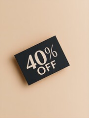 Black '40% OFF' Promotional Sign on a Light Brown Background