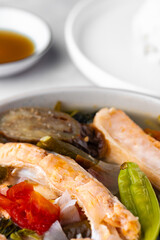 Salmon Belly Sinigang with tomato, kangkong, okra and other vegetables