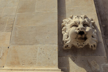 A detailed view of a historic lion stone carving on a wall in Dubrovnik Croatia showcasing...