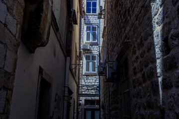 Exploring the narrow streets of Dubrovnik Old Town under the afternoon sun