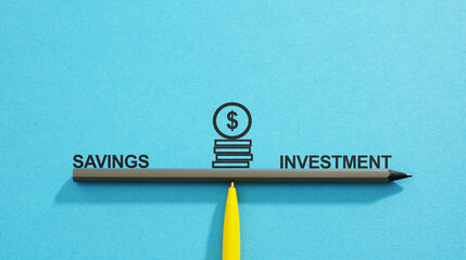 Savings VS Investment is shown using the text on laptop