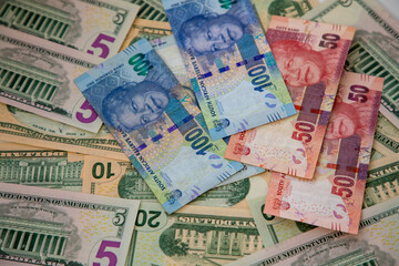 Selective focus on different denominations of US Dollar notes and South African Rand notes.  Concept for exchange rate.  
