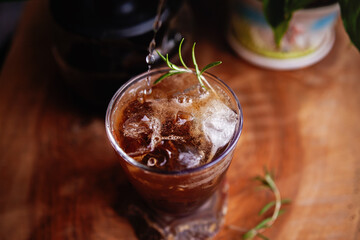 Refreshing Espresso Tonic, cold-brew tonic on a wooden table