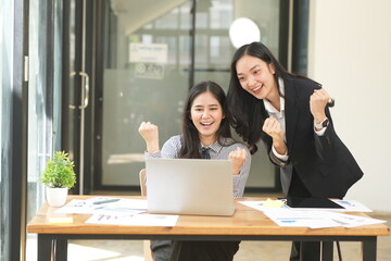 Asian woman succeeds at office