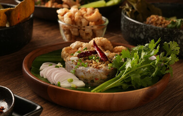 Laab Thaifood menu, raw food. laab moo mee of the North Lanna Thai food style, on table background. thaifood concept. Lanna Thai food.