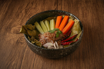 Laab Thaifood menu, raw food. laab moo mee of the North Lanna Thai food style, on table background. thaifood concept. Lanna Thai food.