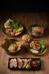 Laab Thaifood menu, raw food. laab moo mee of the North Lanna Thai food style, on table background. thaifood concept. Lanna Thai food.