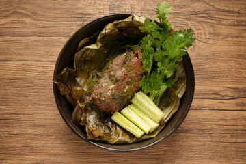 Laab Thaifood menu, raw food. laab moo mee of the North Lanna Thai food style, on table background. thaifood concept. Lanna Thai food.