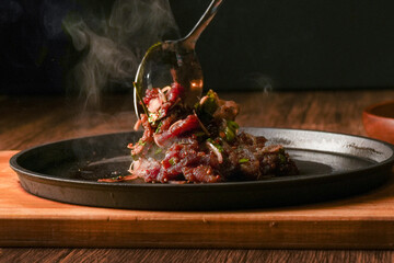 Laab Thaifood menu, raw food. laab moo mee of the North Lanna Thai food style, on table background. thaifood concept. Lanna Thai food.