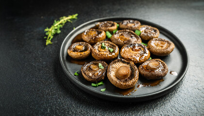 Grilled portobello mushrooms with balsamic glaze. Tasty vegetarian food. Delicious dish. Close-up.
