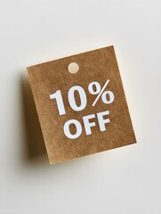 White '10% OFF' Text on a Dark Gold Square Paper Note. White Background 