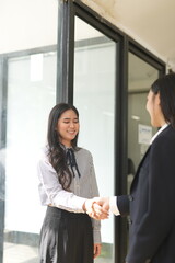 Asian woman succeeds at office